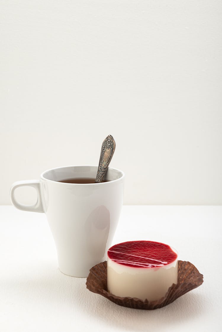 Tea In Mug And Creme Brulee