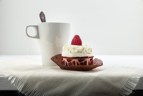 Free A Raspberry Cake Near the Ceramic Cup Stock Photo