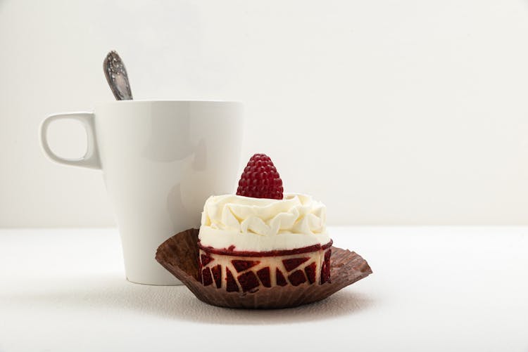 Single Serve Cake With Steaming Mug Of Coffee