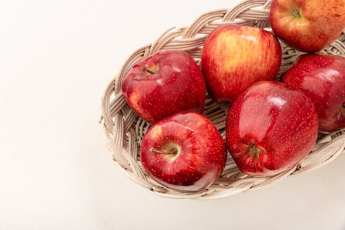 A Red Apples on a Woven Basket