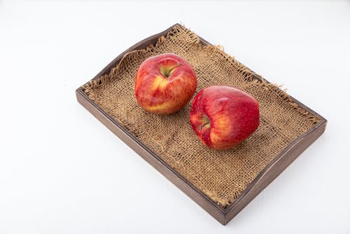 Free Red Apples on a Wooden Tray with Cloth Stock Photo