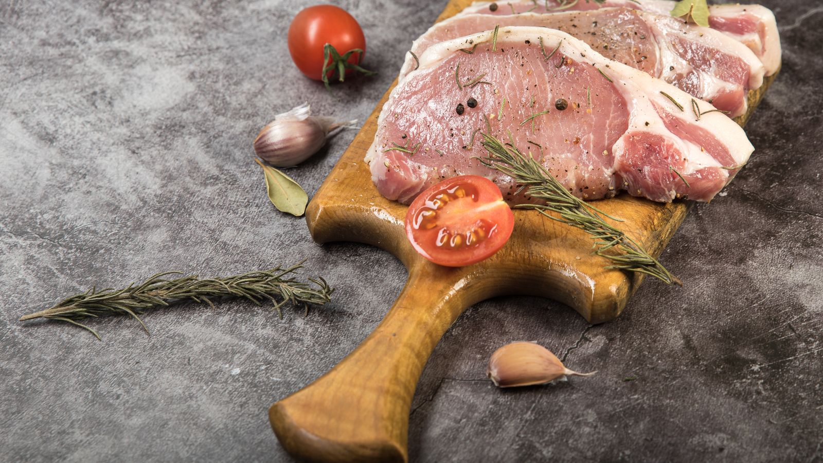 Raw pork chops with rosemary and peppercorns — photo by Shliftik on Pexels Raw pork chops with rosemary and peppercorns