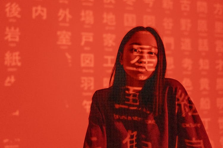 Chinese Characters Overlaying A Woman