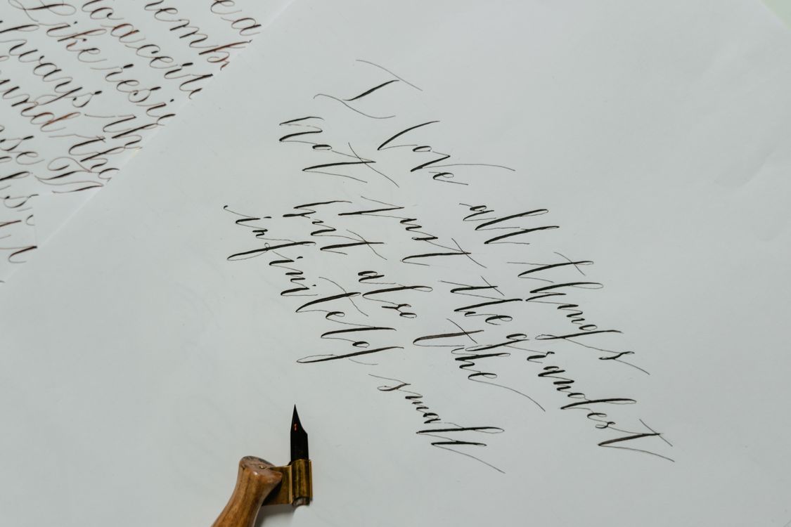 White Script Writing White Paper with Writing · Free Stock Photo