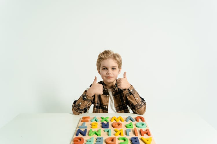 Boy Doing Thumbs Up Both Hands