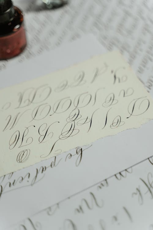 Free Calligraphy on White Paper  Stock Photo