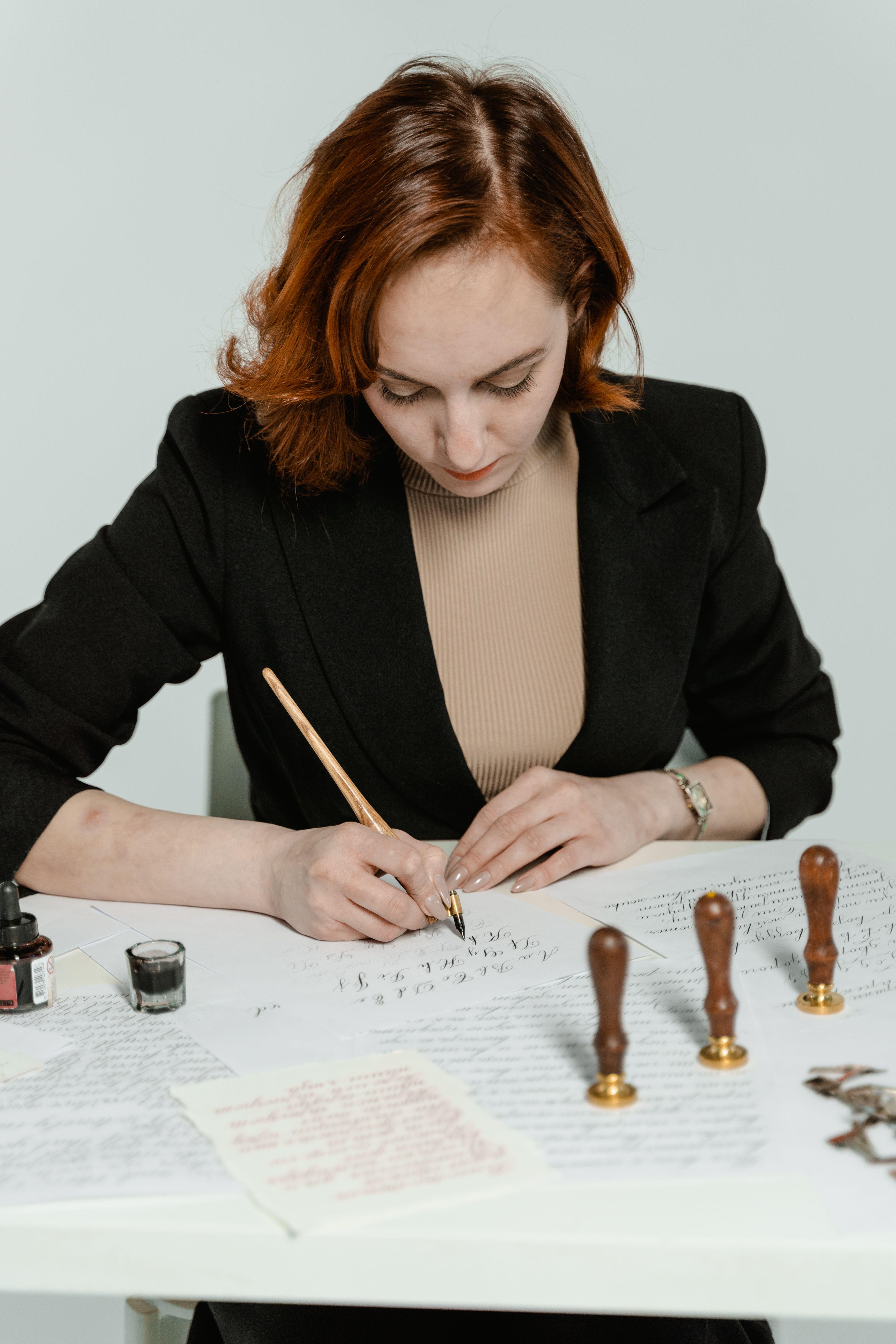 Woman Writing on White Paper · Free Stock Photo