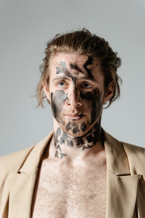 Man With Black Ink on His Face 