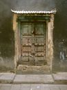 Brown Wooden Door on Gray Concrete Wall