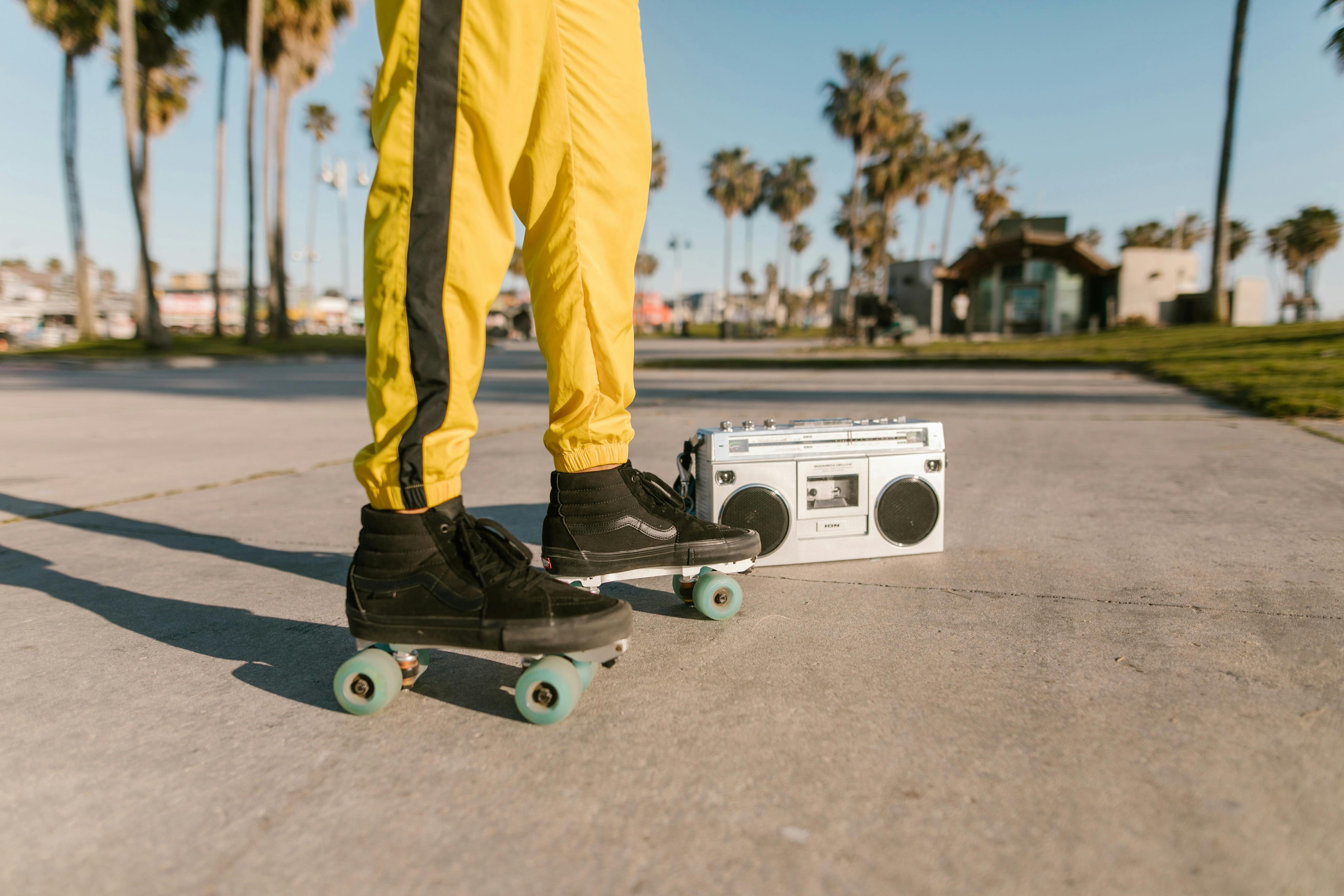 Person Wearing Roller Skates Standing on Concrete Pavement · Free Stock