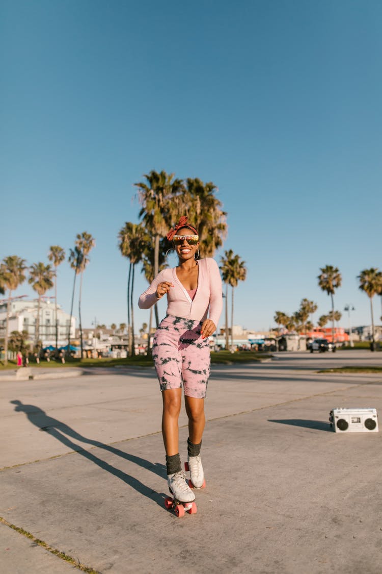 A Woman Roller Skating In The Park