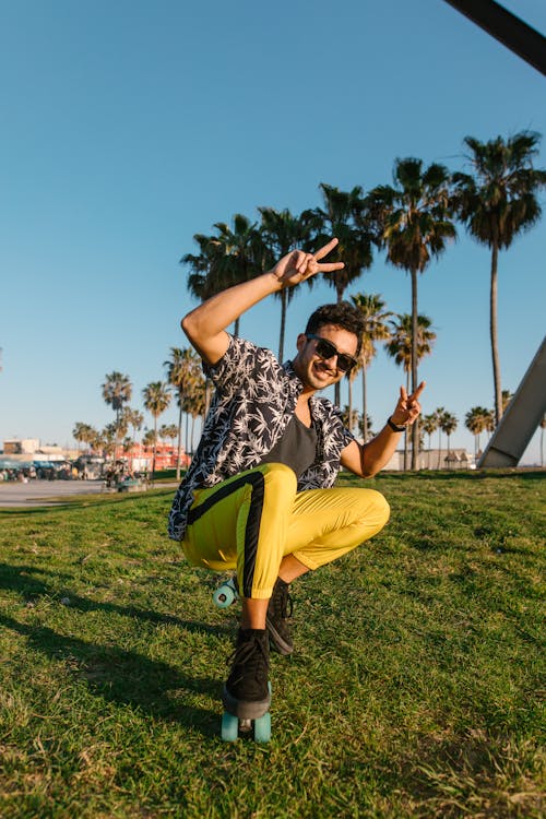 Man in Black and White Button Up Shirt and Yellow Pants