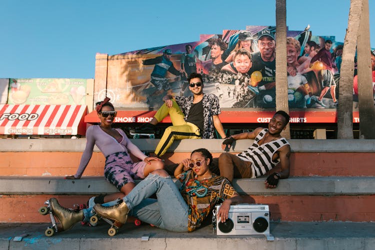 Group Of Roller Skaters Posing Together