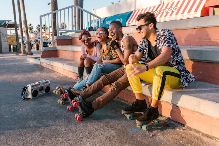 People Sitting On Concrete Bench