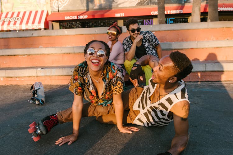 Group Of People Sitting On The Floor