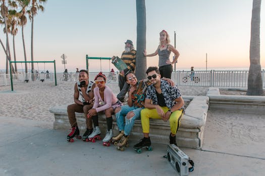 Group of stylish individuals enjoying a skate session at the beach during sunset.