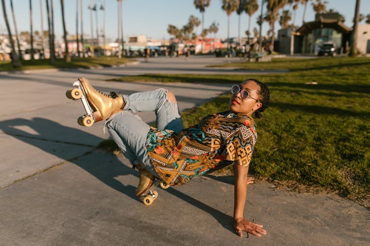 Woman In Brown Printed Shirt Wearing Roller Skates