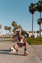 Woman Sitting on Concrete Floor while Wearing Roller Skates