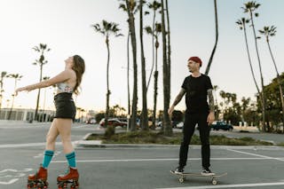 Man and Woman Skating on the Street
