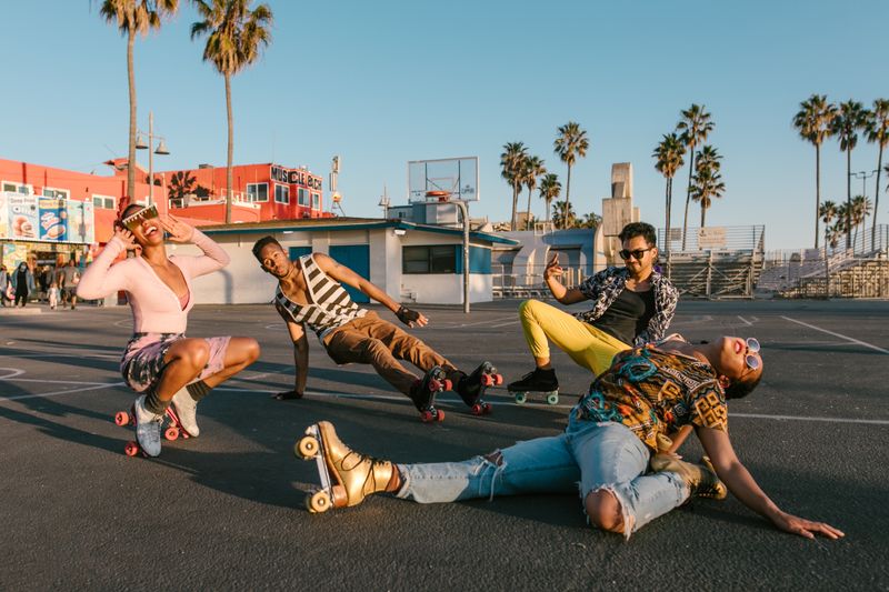 Group posing while wearing roller skates