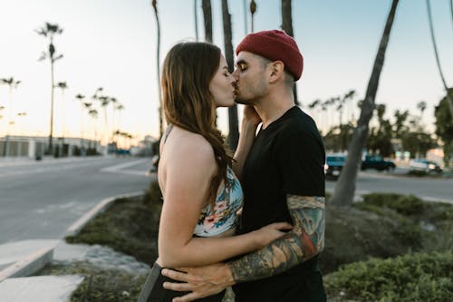 Man and Woman Kissing on the Street