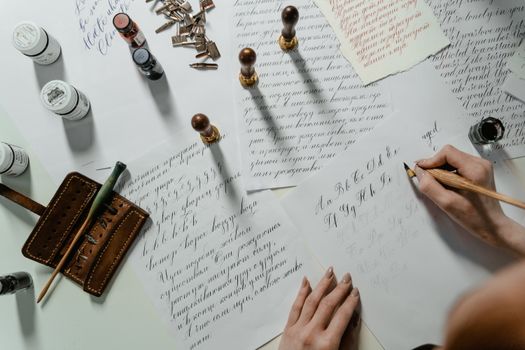 A Person Writing on a White Paper