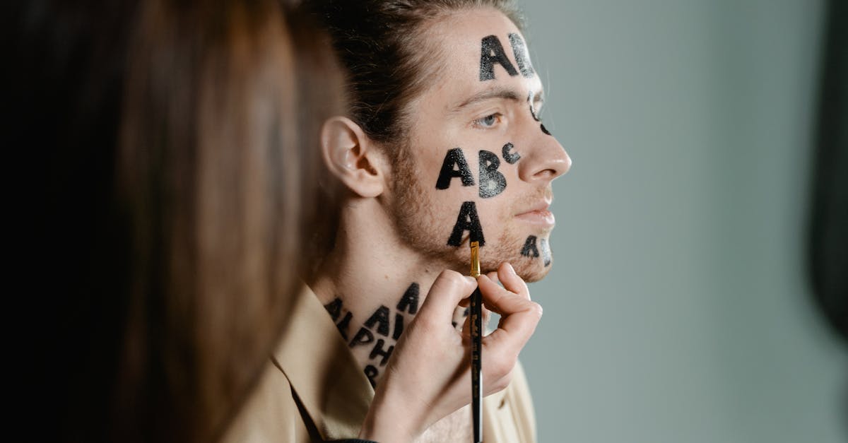 A person looking confused while holding a tangled pile of cords.