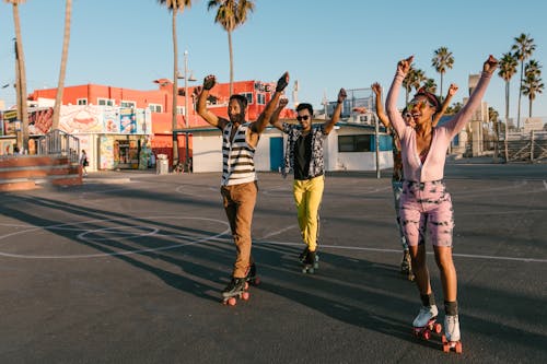 Group of People Wearing Roller Skates