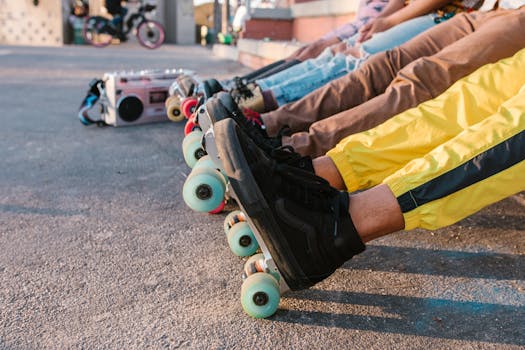 A group of friends relaxing in line with vibrant roller skates at an outdoor skatepark.