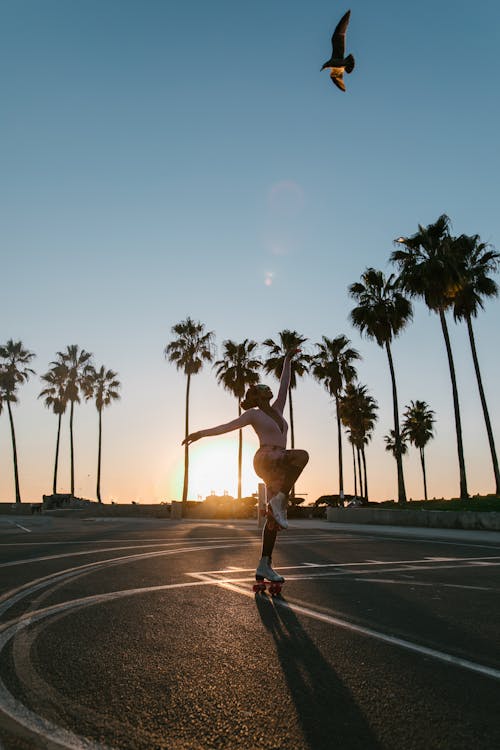 Man in Black Shirt and Shorts Running on Road