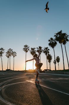 Dynamic silhouette of a roller skater during sunset at Venice Beach, featuring palm trees and an iconic Californian vibe.