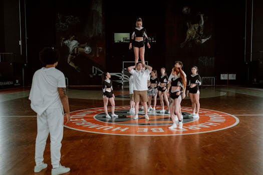 Cheerleading squad practicing routines in a stylish indoor gym, showcasing agility and teamwork.