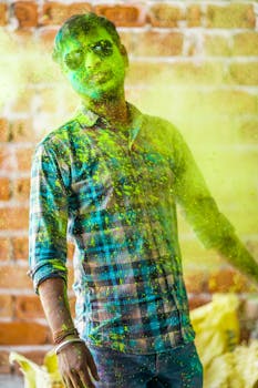 Portrait of a man celebrating Holi with colorful powder in Jaipur, India.