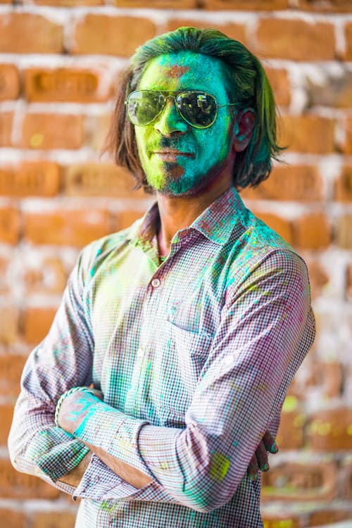 Man in Green and White Plaid Button Up Shirt Wearing Green Sunglasses