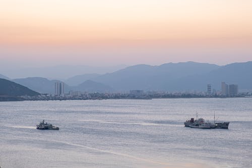 Ships floating on rippling sea