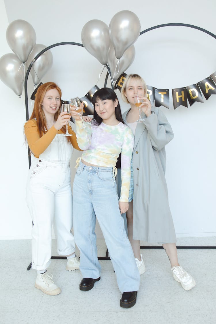 Group Of Friends Raising Toast At Birthday Party