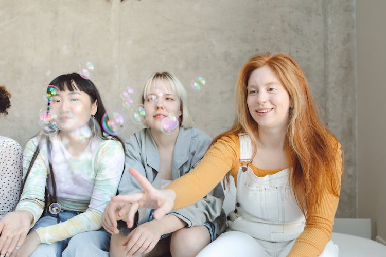 Women Catching Bubbles