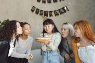 Women Standing Around the Birthday Celebrant