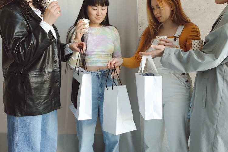 Girls Holding Shopping Bags With Presents