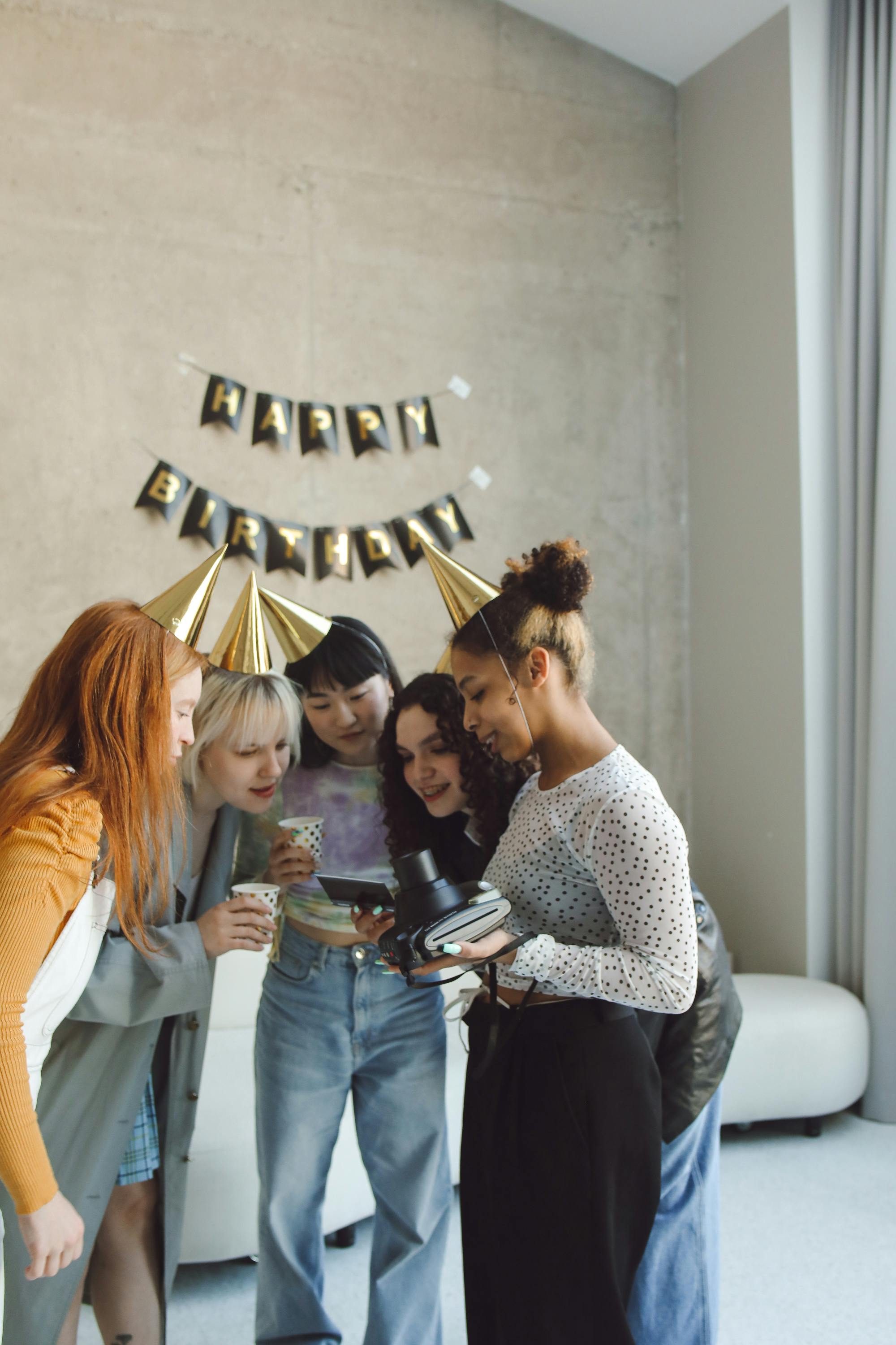 group of women looking at a photo