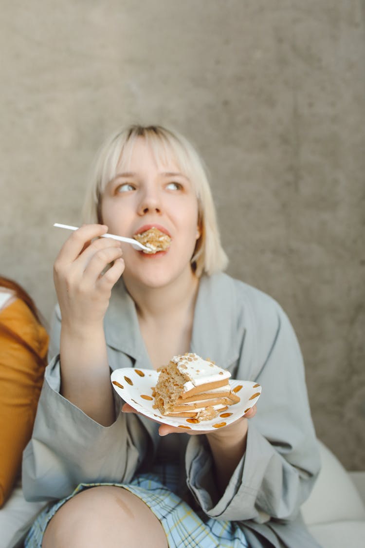 Blonde Woman Eating Cake