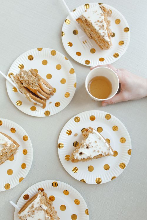 Free Top view of cake slices on polka dot plates and a cup of coffee. Perfect for dessert themes. Stock Photo