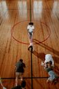 Man in White T-shirt and Black Shorts Playing Basketball