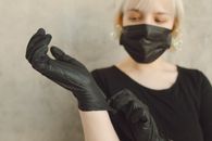 Woman in Black Long Sleeve Shirt Wearing Black Mask