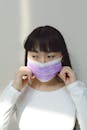 A Woman with Bangs Wearing a Face Mask