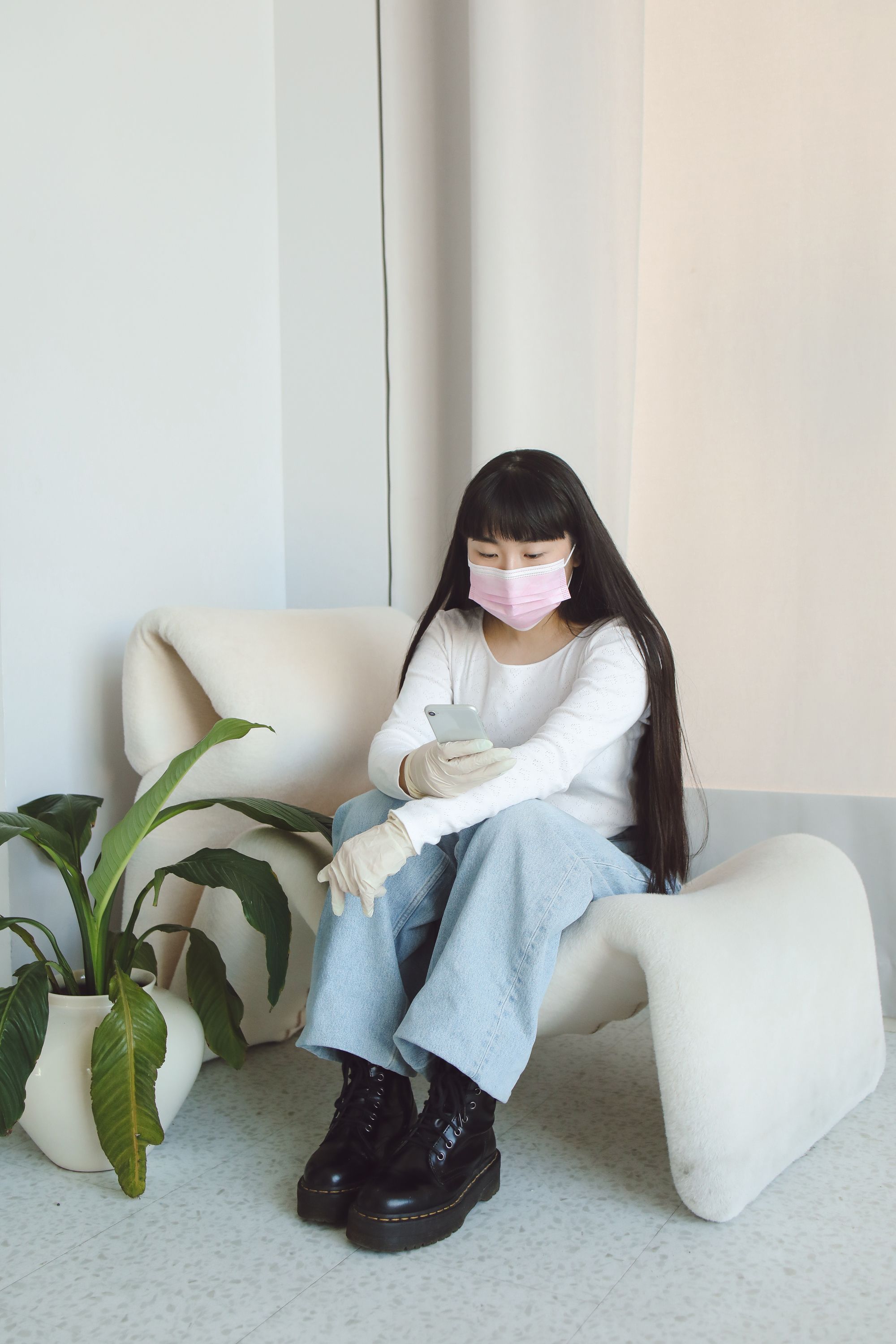 Woman in White Long Sleeve Shirt Sitting on Chair · Free Stock Photo