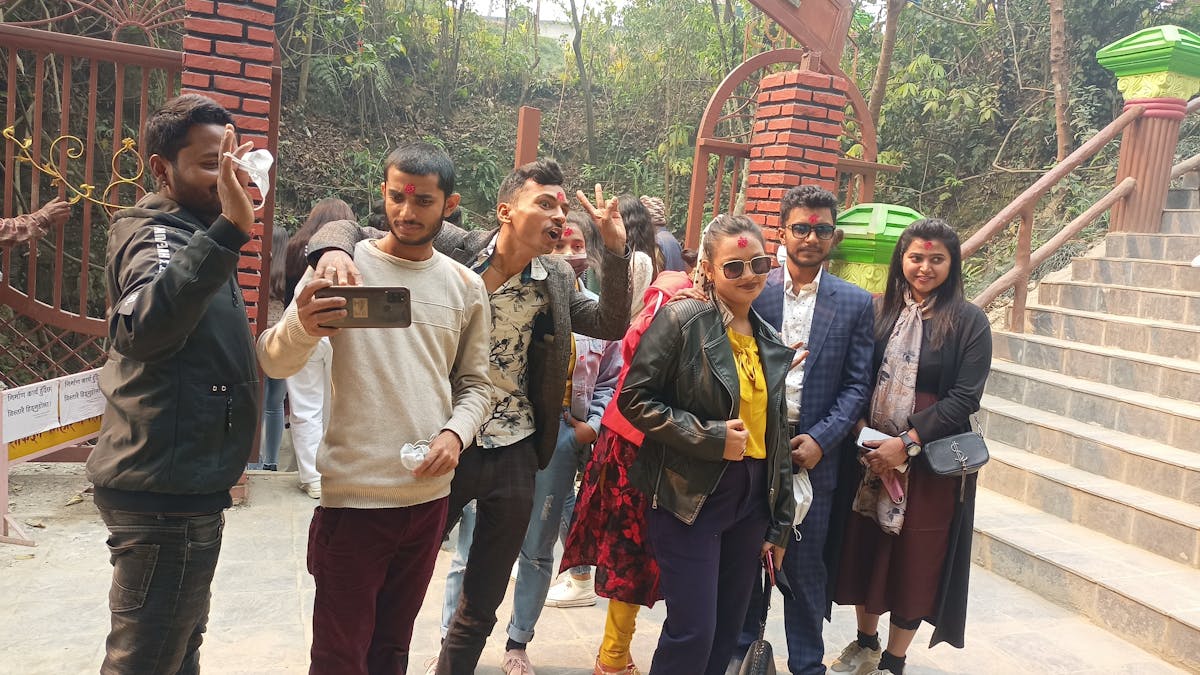 Team collaborating on laptops and tablets with charts showing engagement metrics