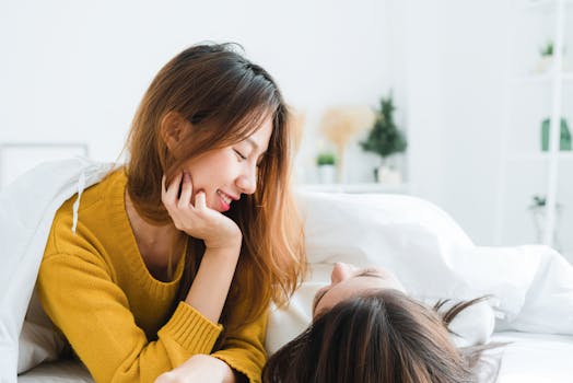 Woman Wearing Sweatshirt Lying on White Mattress