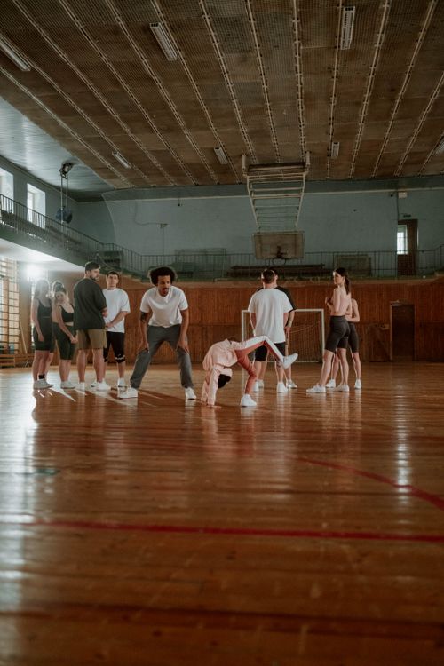 Free Group training session in a gym with focus on teamwork and skill building. Stock Photo