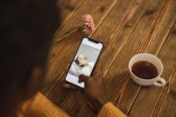 Person using Black Smartphone